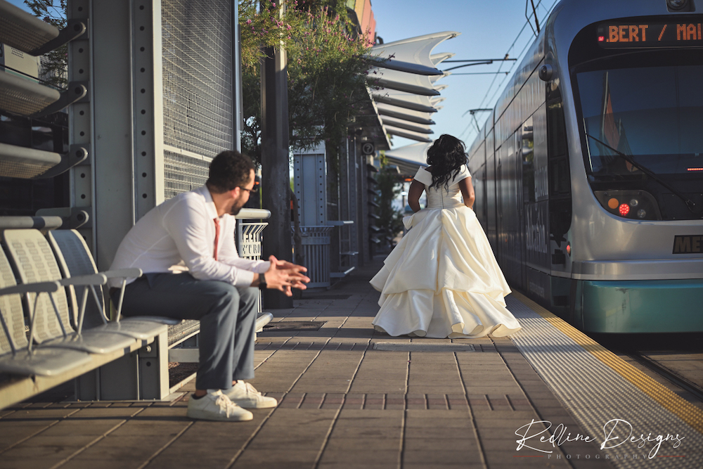 Kelly running for the metro train in her wedding dress