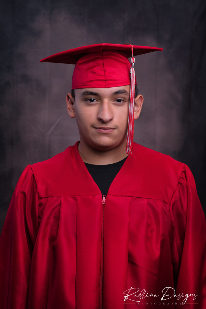 Gabriel Lopez in a cap and gown